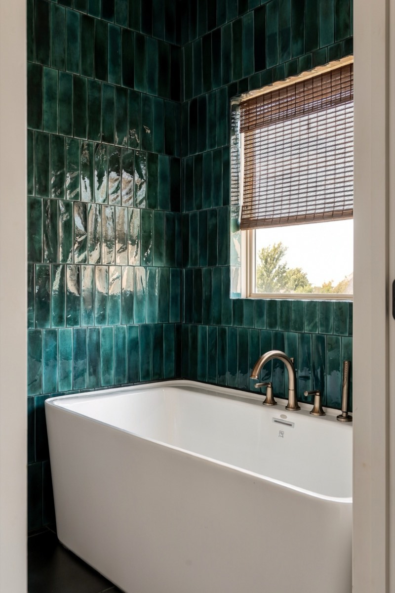 Emerald zellige tile bathroom with a freestanding soaking tub