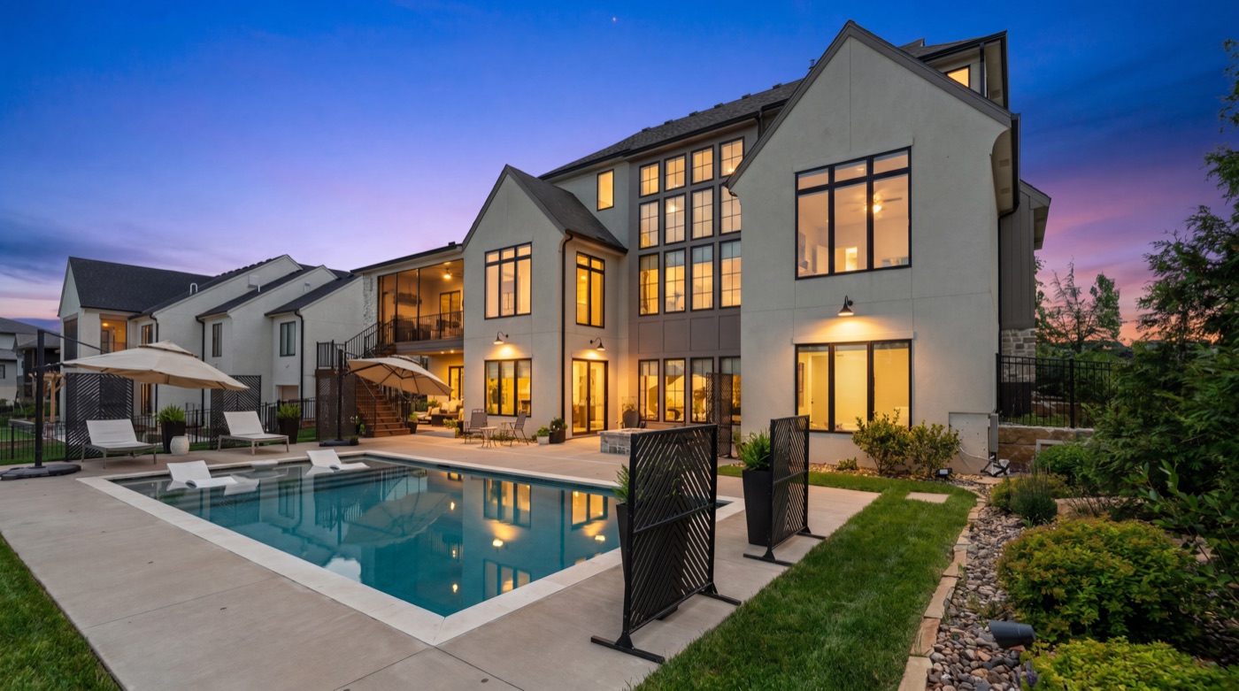 Modern home with pool at twilight